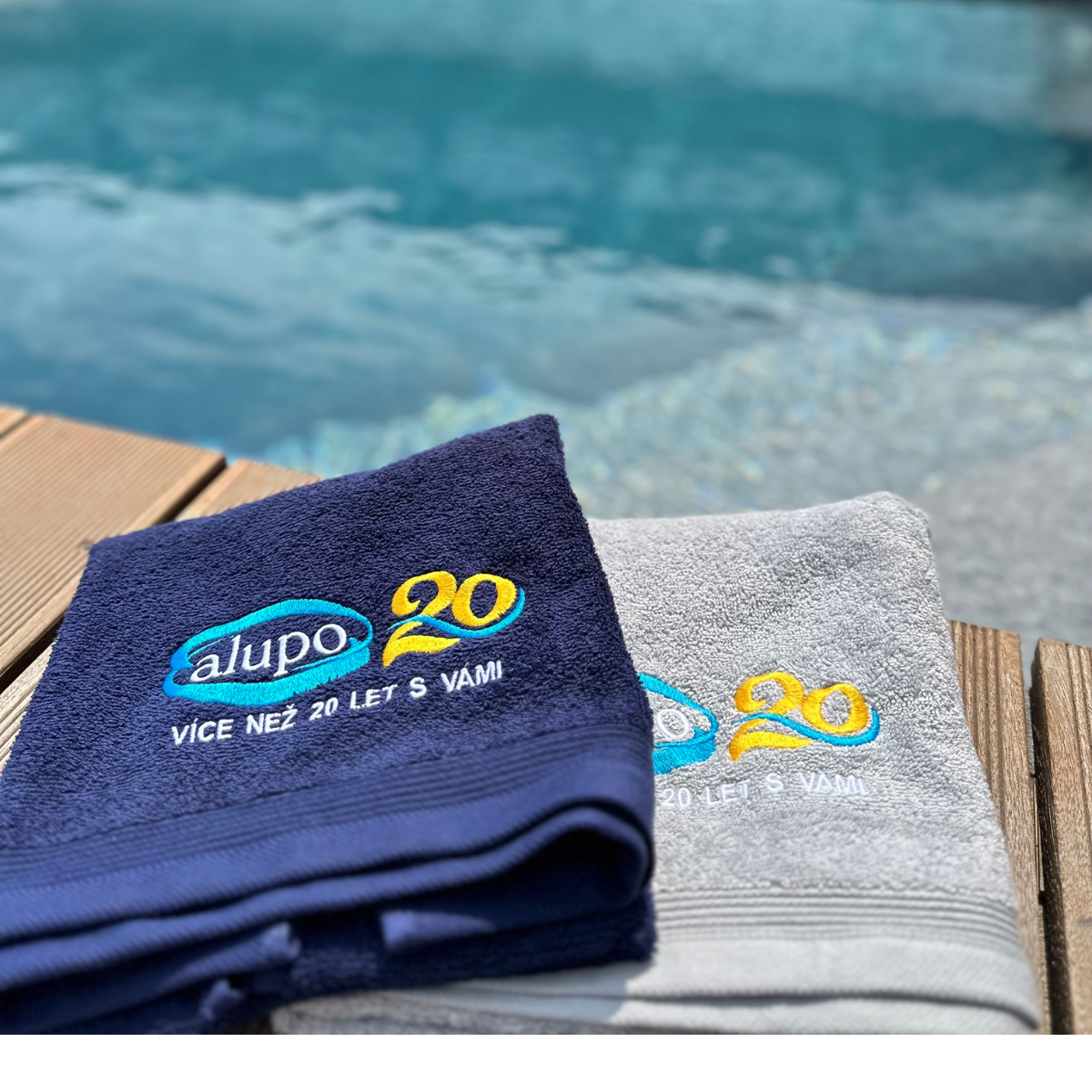 vyšívání loga na ručníky k výročí firmy Alupo - firemní merch